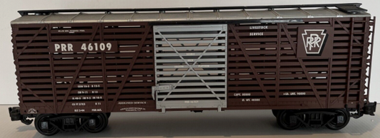 Aristocraft Steel Stock Car toy train model in brown, gray, and silver colors, with the name 'Pennsylvania Railroad' printed on the side.