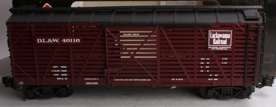 Red Aristocraft steel stock car toy train component, with the name 'Delaware Lakwanna & Western' printed on the side.