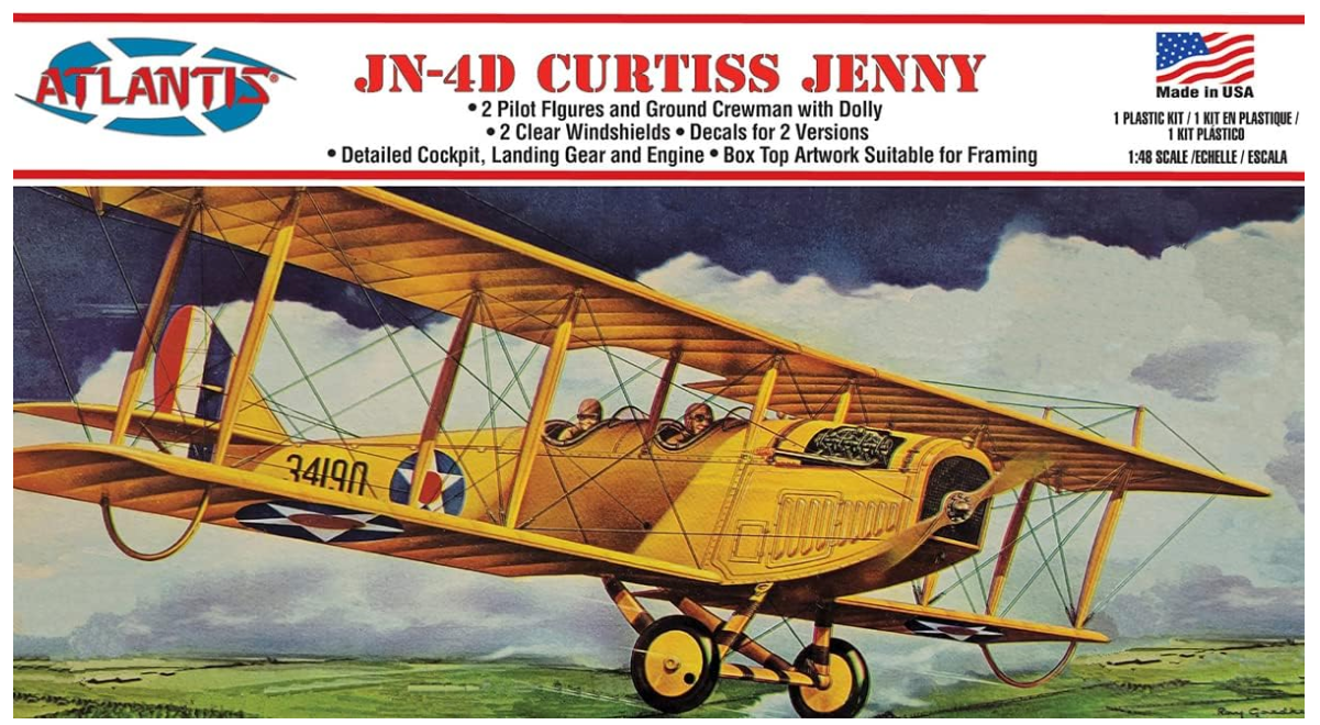 A 1/48 scale model of the Curtiss JN-4D Jenny aircraft, with decals for three different versions.