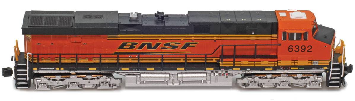 Model train locomotive with BNSF logo on a white background