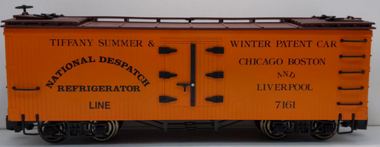 An orange Bachmann National Despatch refrigerator reefer model train car with metal wheels and text detailing.
