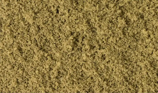 A bag of coarse, earth-colored turf for model train setups.