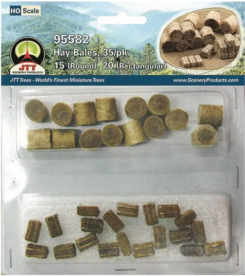 Packaging for JTT 95582 HAY BALES, displaying both round and rectangular shaped hay bales intended for use in model train setups.