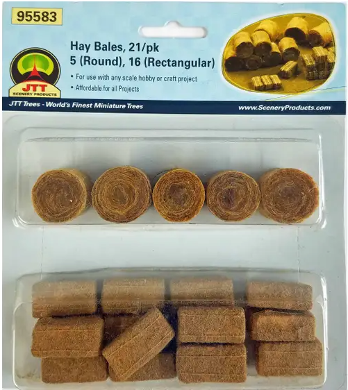 A package of JTT model train hay bales, containing 5 round and 16 rectangular pieces in a mix of brown and beige colors.