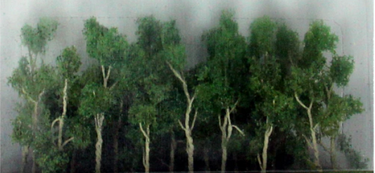 A set of model trees and shrubs in green color for N scale model train setups.
