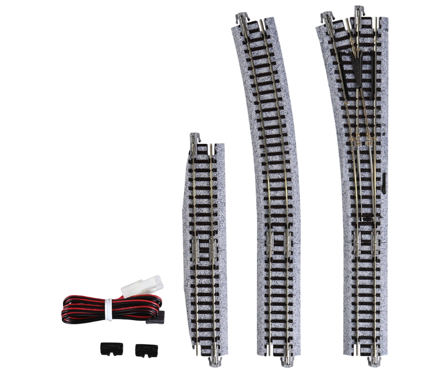 Model train tracks and accessories on a white background