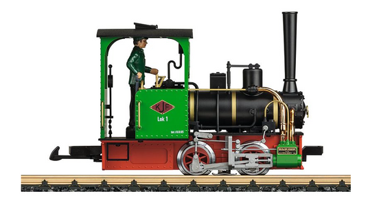 A toy model of a green and red field railroad locomotive with a man in a green jacket operating it.