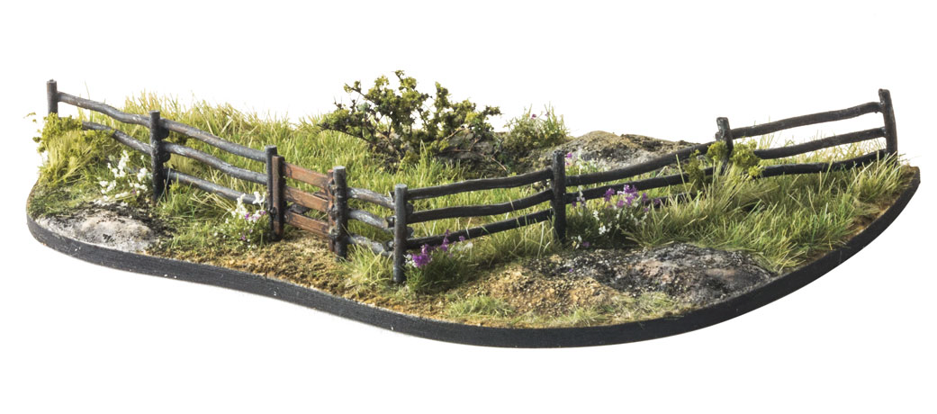 log fence with grass