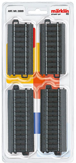 A set of toy train tracks in a clear plastic packaging, with the tracks visible in gray and a few pieces in a different color.