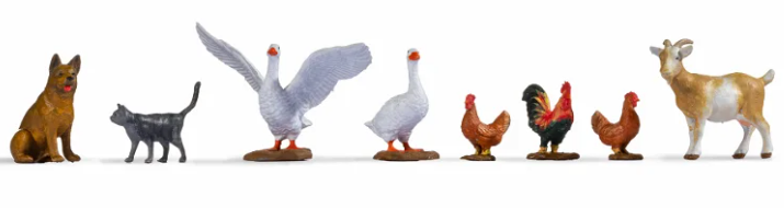 A set of toy figures representing different farm animals, intended for use in O-scale model setups.