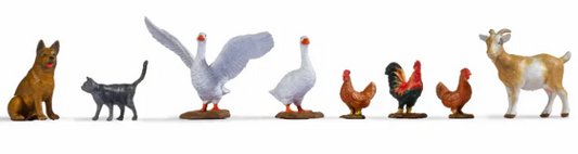A set of toy figures representing different farm animals, intended for use in O-scale model setups.