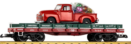 A model of a red diecast pickup truck with a flatbed carrying Christmas ornaments, detailed with wood platform and removable side boards.