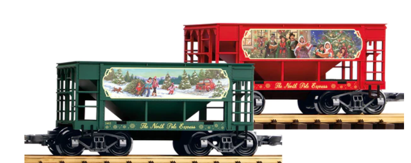 Two model trains with Christmas-themed ore car containers in green and red colors, featuring holiday decorations and factory applied details such as ladders and stirrup steps.