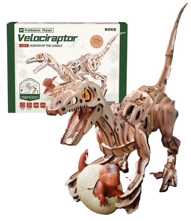 Wooden velociraptor model with hatching baby dinosaur and packaging in the background