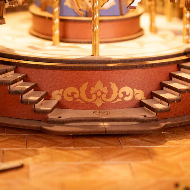 Close-up of a decorative wooden carousel with intricate details