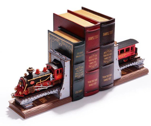 Model train set on a track with books as scenery