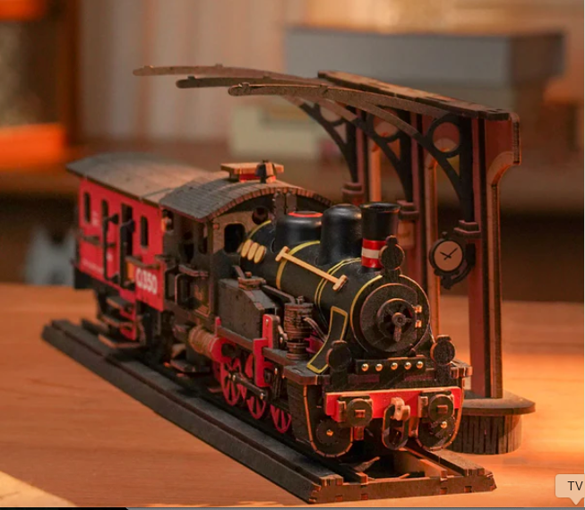 Model train set on a wooden platform with a blurred background