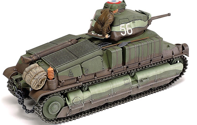 Model tank with a figure on top, detailed with various attachments, on a white background