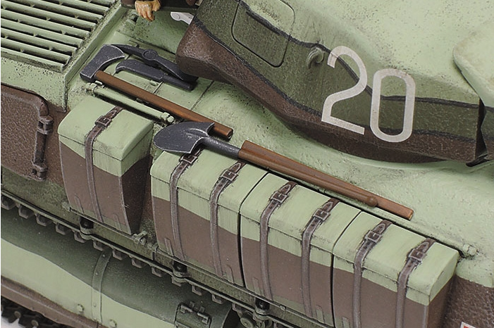 Model tank with tools and a shovel on top, featuring the number 20.