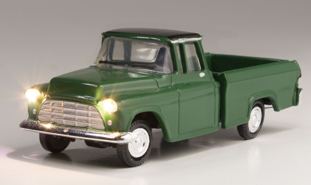 Green pickup with lights