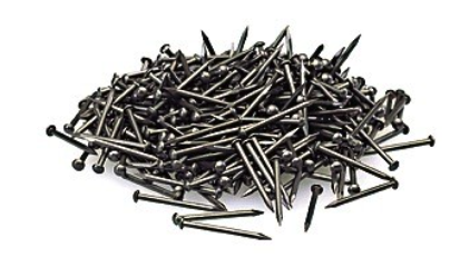 A pile of black track nails for model trains.