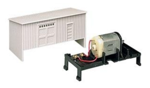 A turntable motor drive unit for a model train, consisting of a motor housing and a belt, designed for quiet operation.