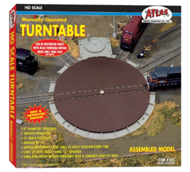 The image shows the packaging of the Atlas HO 305 Manual Turntable, which is a model train accessory featuring a brown turntable deck and tracks.