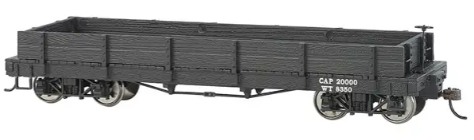 A black plastic model of a Bachmann ON30 gondola train car.
