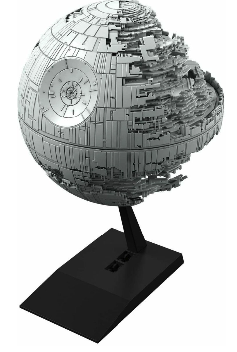 A completed model of the Star Wars Death Star II, displayed on a stand, with a black base and no painting visible on the model.
