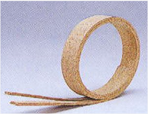 A single piece of beige cork trackbed for model railroads, with a natural wood grain texture.