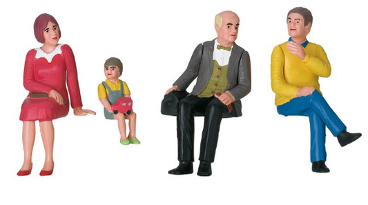 A set of four miniature figures designed for use with nostalgic cars and layouts. They are seated and appear to be made of a soft material, possibly plastic or resin.