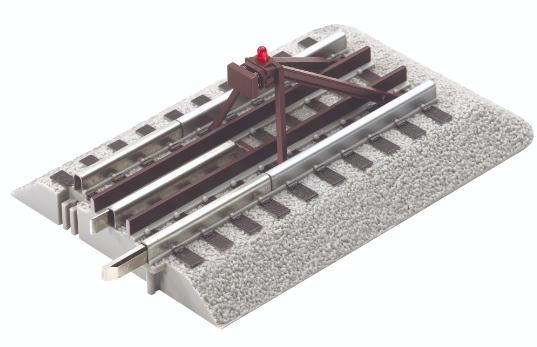 A  bumper with sprung bumper plates and an illuminated red warning light for an O scale model train.