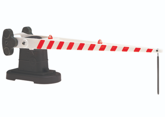Lionel auto crossing gate toy train component with a white and red striped arm, black base, and red operating lights.
