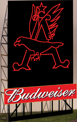 A roadside Budweiser-branded eagle billboard with red and black colors, featuring a flap-winged eagle, mounted on a grey surface.