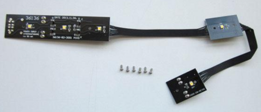 PIKO interior light for a Drovers Caboose, consisting of a black light bar and several small metal components.