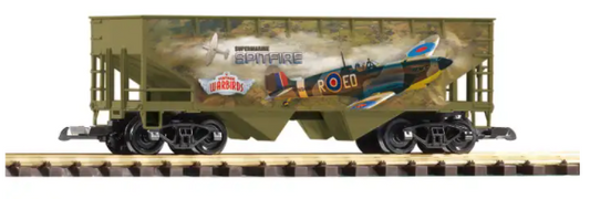 A model of a Spitfire hopper car with vintage warbirds design, predominantly green with camouflage patterns and an open top design.