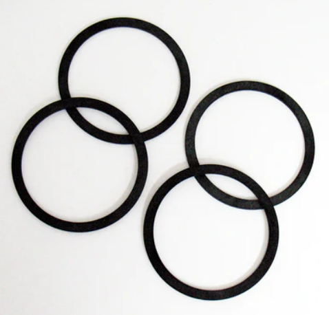 Three black rubber traction tires for model trains.