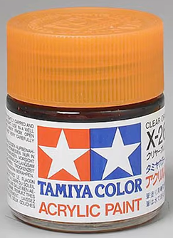 A 23ml bottle of Tamiya X-26 Clear Orange Gloss Finish Acrylic Paint with label and cap visible.
