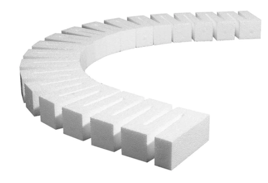 A set of white foam risers for model train layout, arranged in a semi-circular pattern.