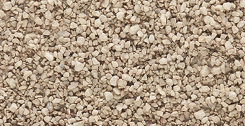 A close-up view of medium ballast shaker for model trains in a buff color.