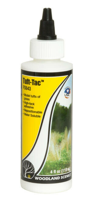 A bottle of Woodland Scenics FS643 Tuft-tac, a thick high-tack adhesive for modeling purposes.