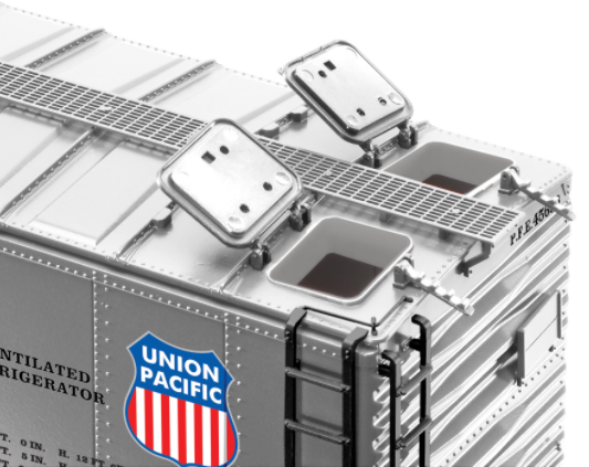 Lionel Pacific Fruit Express silver steel-sided refrigerator car model train component with detailed metal underframe and opening roof hatches.