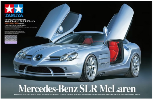A 1:24 scale model of a Mercedes-Benz SLR McLaren, predominantly silver in color, with the model's open lid showing the interior details.