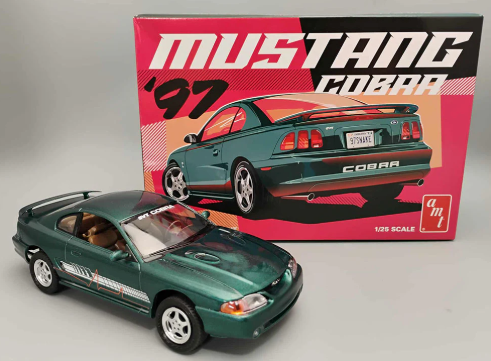 Model car of a '97 Mustang Cobra in front of its packaging box.