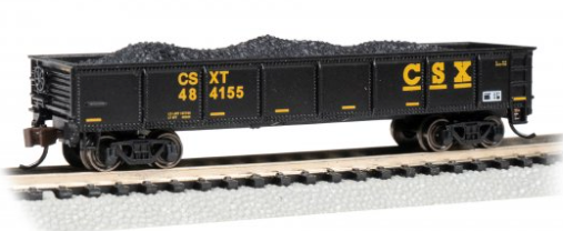 Model train car with CSX branding on a track