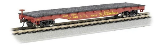 Model train car on a track with 'Road of the Iron Horse' branding.