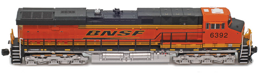 Model train locomotive with BNSF logo on a white background