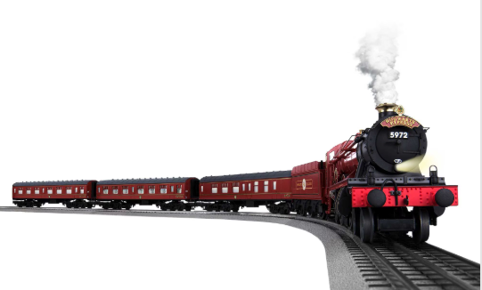 Model steam train on tracks with white background
