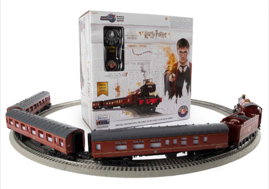 Model train set with track and packaging featuring a character from 'Harry Potter'.