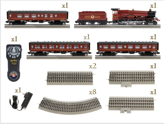 Model train set with locomotive, cars, tracks, and control device on a white background